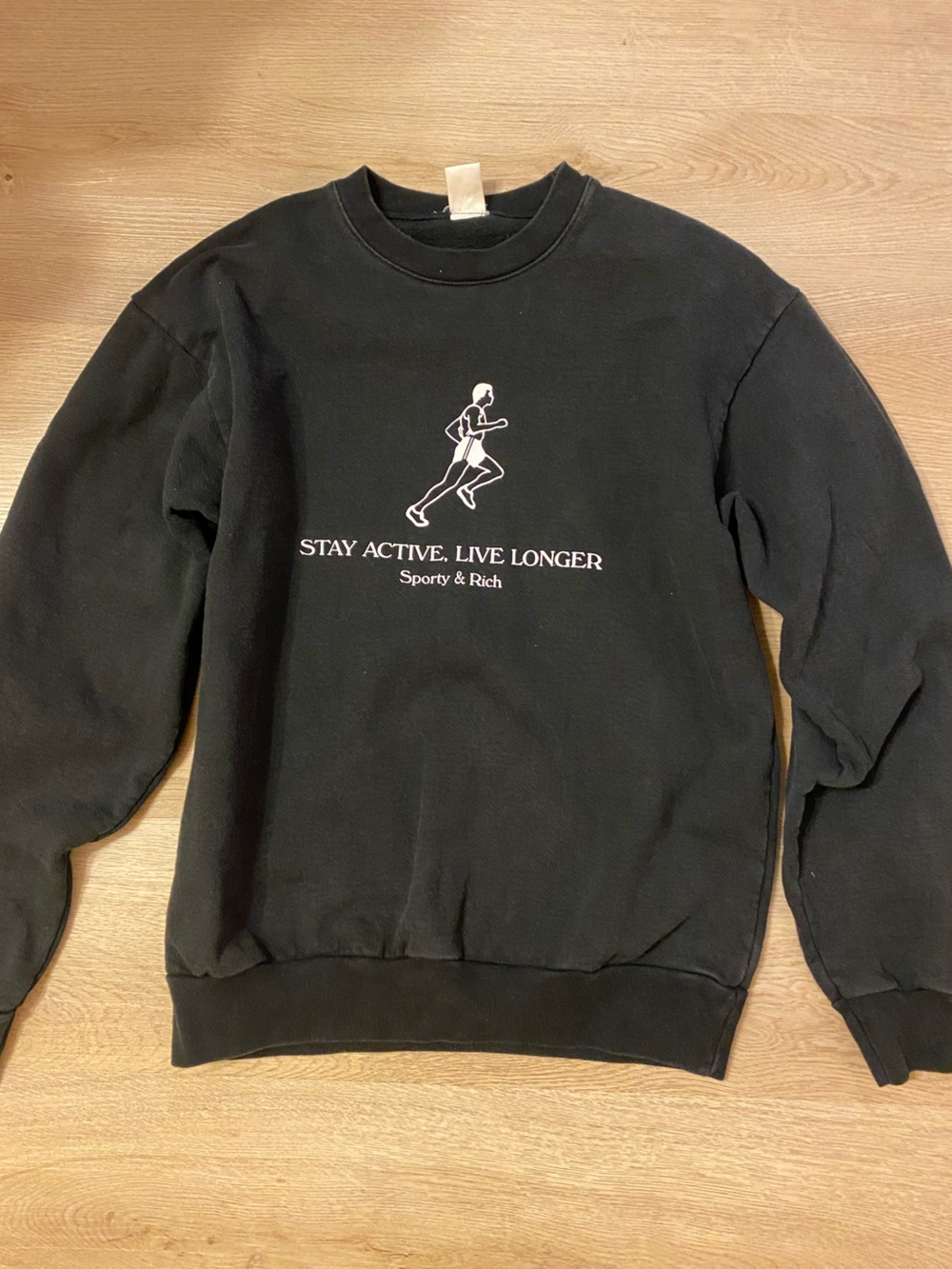 Sporty & Rich Black Crewneck Sweatshirt with White Runner Graphic